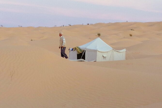 2 days tour to Douz & Ksar Ghilan oasis. and an overnight in the sahara under bedouin tent .. Dinner in the camp, Private Jeep - with english speaking guide. - The road to Douz and the desert camp