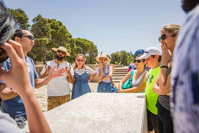 Group Guided Bike Tour of Carthage Archeological Site in Tunisia - Reading the Punic Ports beside the water